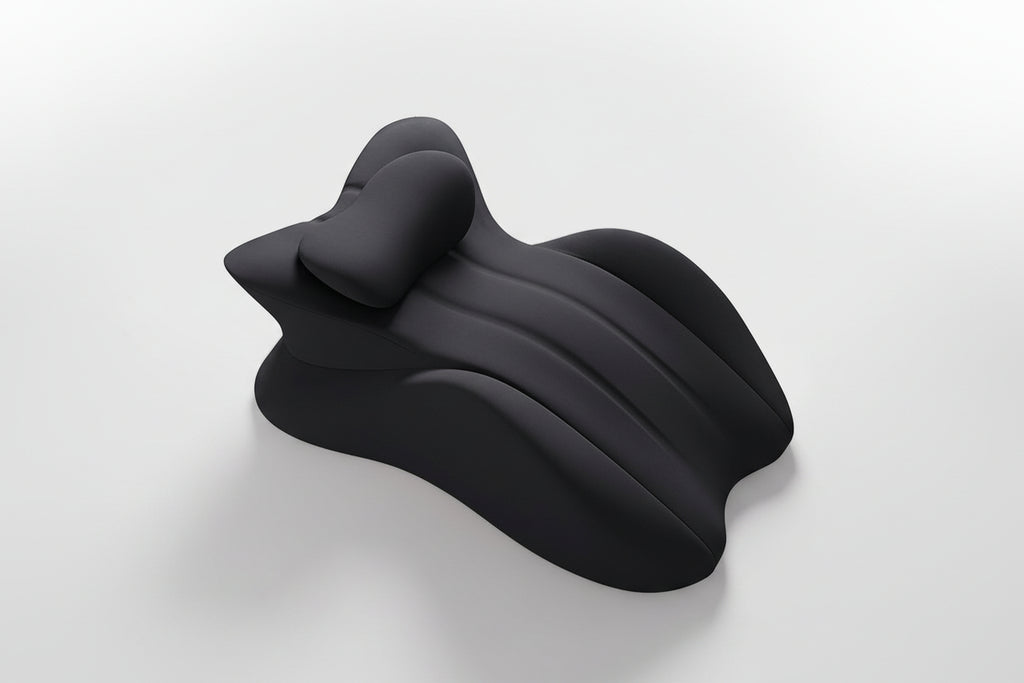 Black neck pillow on a light gray background with text 'Free your hands and relax your whole body'.