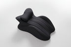 Black neck pillow on a light gray background with text 'Free your hands and relax your whole body'.