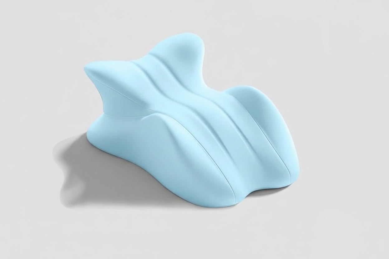 Blue shark-shaped pillow on a light gray background